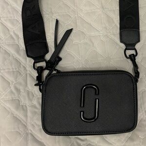 Marc Jacob’s snapshot bag in black.